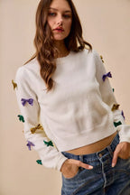 SO ME Sweater Knit Top Mardi Gras Glitter Bow Ribbon Ivory 02cf230d47754667815dcc086668d556-Max-Origin Trendsi