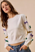 SO ME Sweater Knit Top Mardi Gras Glitter Bow Ribbon Ivory 0b2fe12500a94837b852bea5ebb67781-Max-Origin Trendsi