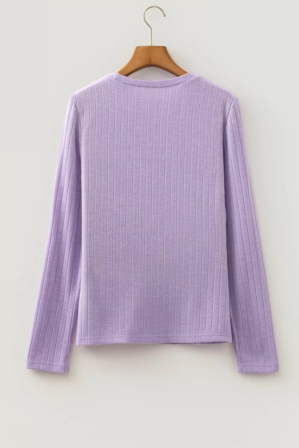 Back view of lavender ribbed sweater on hanger displaying continuous vertical ribbed pattern