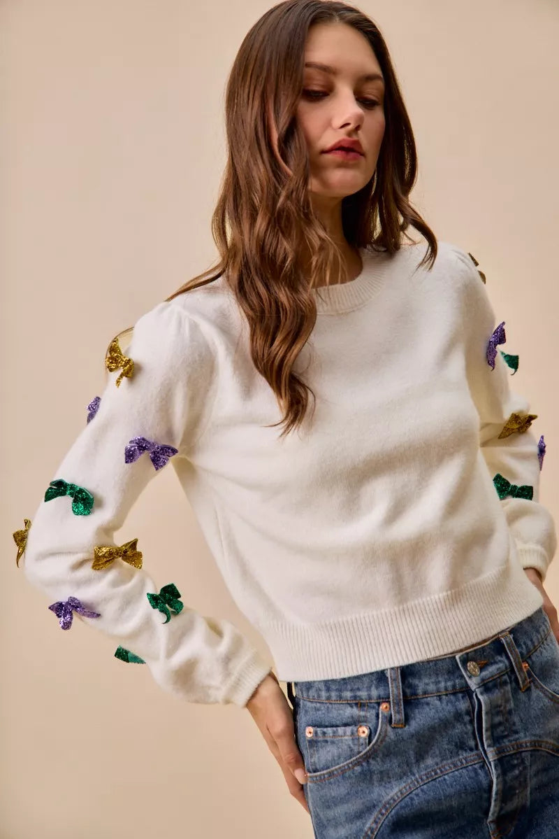 SO ME Sweater Knit Top Mardi Gras Glitter Bow Ribbon Ivory 0dc571b250214473b71643f9c34508c0-Max-Origin Trendsi
