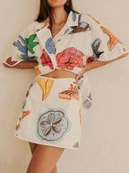Women's Outfit Set Shirt Multicolor Floral Button Up Short Sleeve and Tied Shorts 10fc19e9-413e-4ed5-ad34-7de0c4ac08f4-Max-Origin Trendsi