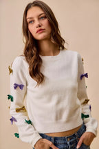 SO ME Sweater Knit Top Mardi Gras Glitter Bow Ribbon Ivory 125d917430074a31adcfa7daabe33d72-Max-Origin Trendsi