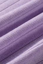 Soft lavender ribbed knit fabric with vertical stitching lines and smooth stretchy texture folds