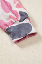 Ribbed elastic sleeve cuff detail showcasing stretchy knit texture against beige background