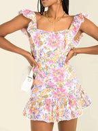 Floral Mini Dress Colorful Print Ruffled Hem Cutout Bow Tied Backless Floral 1d24dce2-d70f-4abf-93d5-5df4e0dd191c-Max-Origin Trendsi