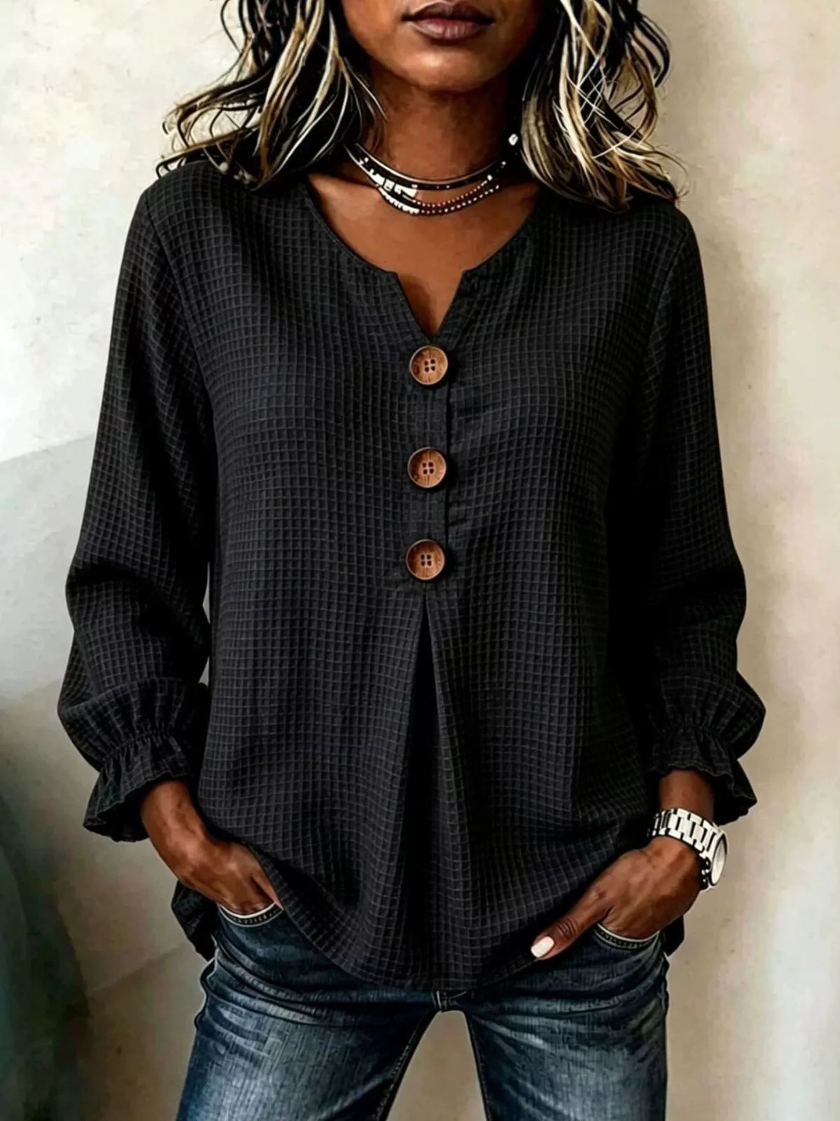 Blusa de punto texturizada negra con mangas fruncidas y ajuste relajado