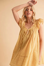 Aemi+Co Mini Dress Ruffled Cap Short Sleeve Cotton Tunic Smocked 215f980372e04ac2b3ce0fd6d277aee5-Max-Origin Trendsi