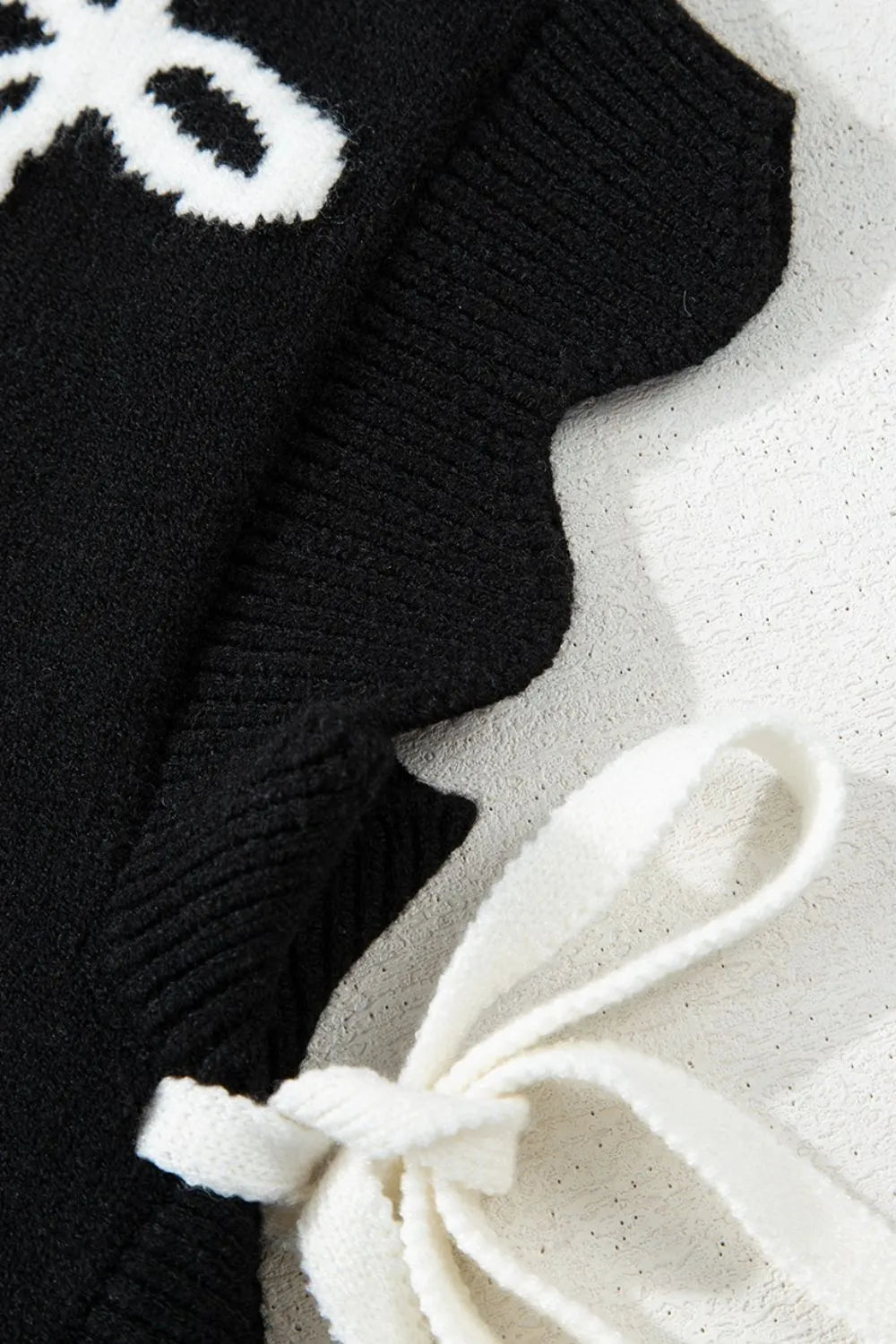 Women's Sweater Black Bow Side Ties Scalloped Hem Cap Sleeve 24c4b5cc-575a-42d3-8ab0-62c32aea01be-Max-Origin Trendsi