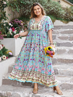 Plus Size Printed Maxi Dress with Tie Neck and Flutter Sleeves