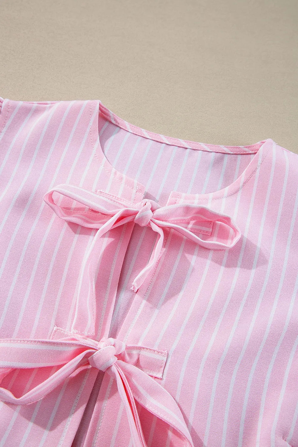 Women's Blouse Striped Blush Pink Bow Tie Front Peplum Long Sleeve Top 34edc77e-ac90-44b6-8e51-398e75ea118d-Max-Origin Trendsi