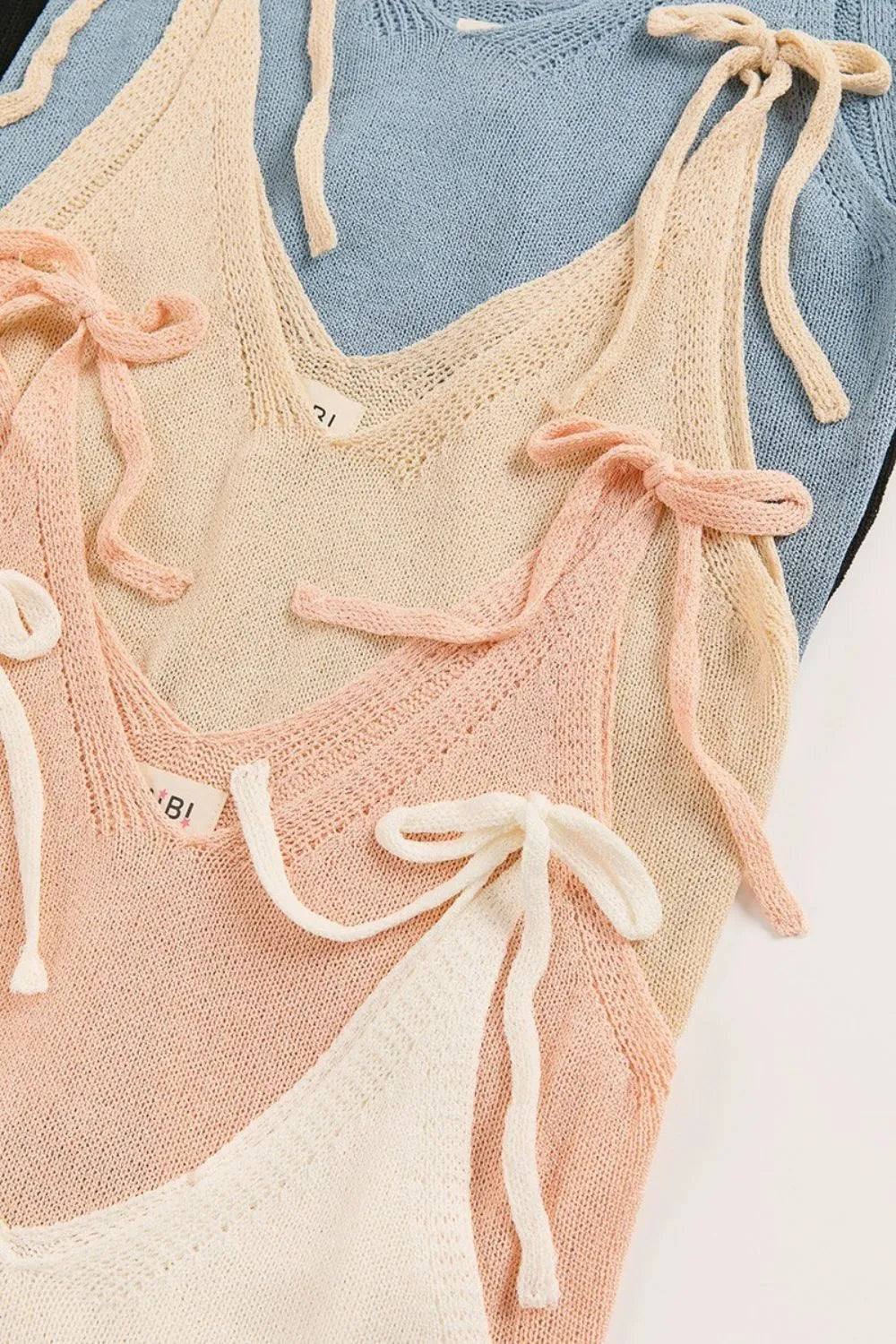 BiBi Knit Top Bow Tied Shoulder Starps Solid Off White Cami Blouse 3d6dd87a-500f-4bfe-9069-edd864881779-Max-Origin Trendsi