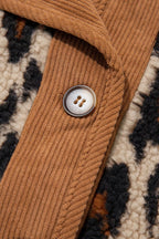 Collar detail showing camel corduroy trim and silver button against textured black and cream leopard print