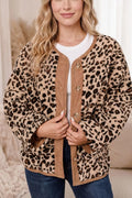 Front view of loose fit leopard print jacket with brown corduroy trim over white tee and denim