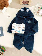 Navy blue sherpa fleece baby boy hoodie set with bear ears and dinosaur print laid flat on white surface