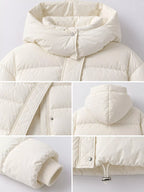 Detail collage of cream puffer jacket construction including structured hood shape and metal cord lock