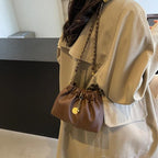 Mini Bucket Drawstring Bags Chain Strap Tassel Women's Soft Leather Crossbody 57_e82319c5-c474-43dd-a320-d8242a979fbb STYLEINGER