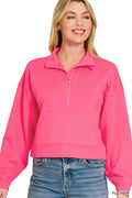 Model in vibrant fuchsia quarter zip pullover with open collar and kangaroo pocket against white background