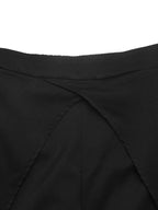 Front waist area featuring overlapping panel design with diagonal seams and elastic top
