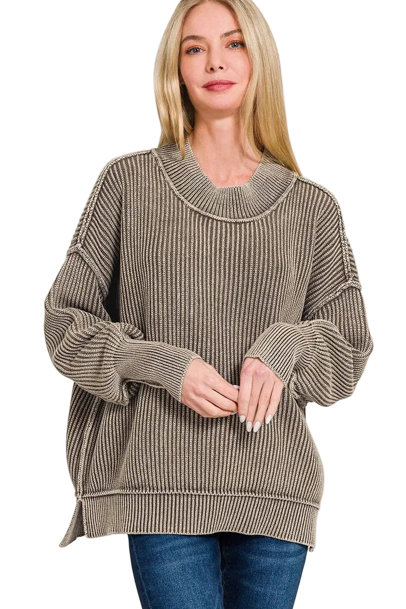 Blonde model in mocha oversized ribbed knit sweater with layered mock neck and dropped shoulders, paired with blue jeans