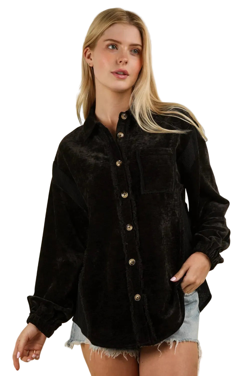 Black crushed velvet shacket with corduroy sleeves, gold buttons, and raw hem styled over denim shorts