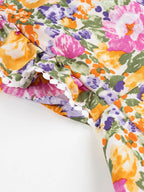 Floral Mini Dress Colorful Print Ruffled Hem Cutout Bow Tied Backless 60da2b5b-3f5d-4b87-a6a7-84d68f5d99ad-Max-Origin Trendsi