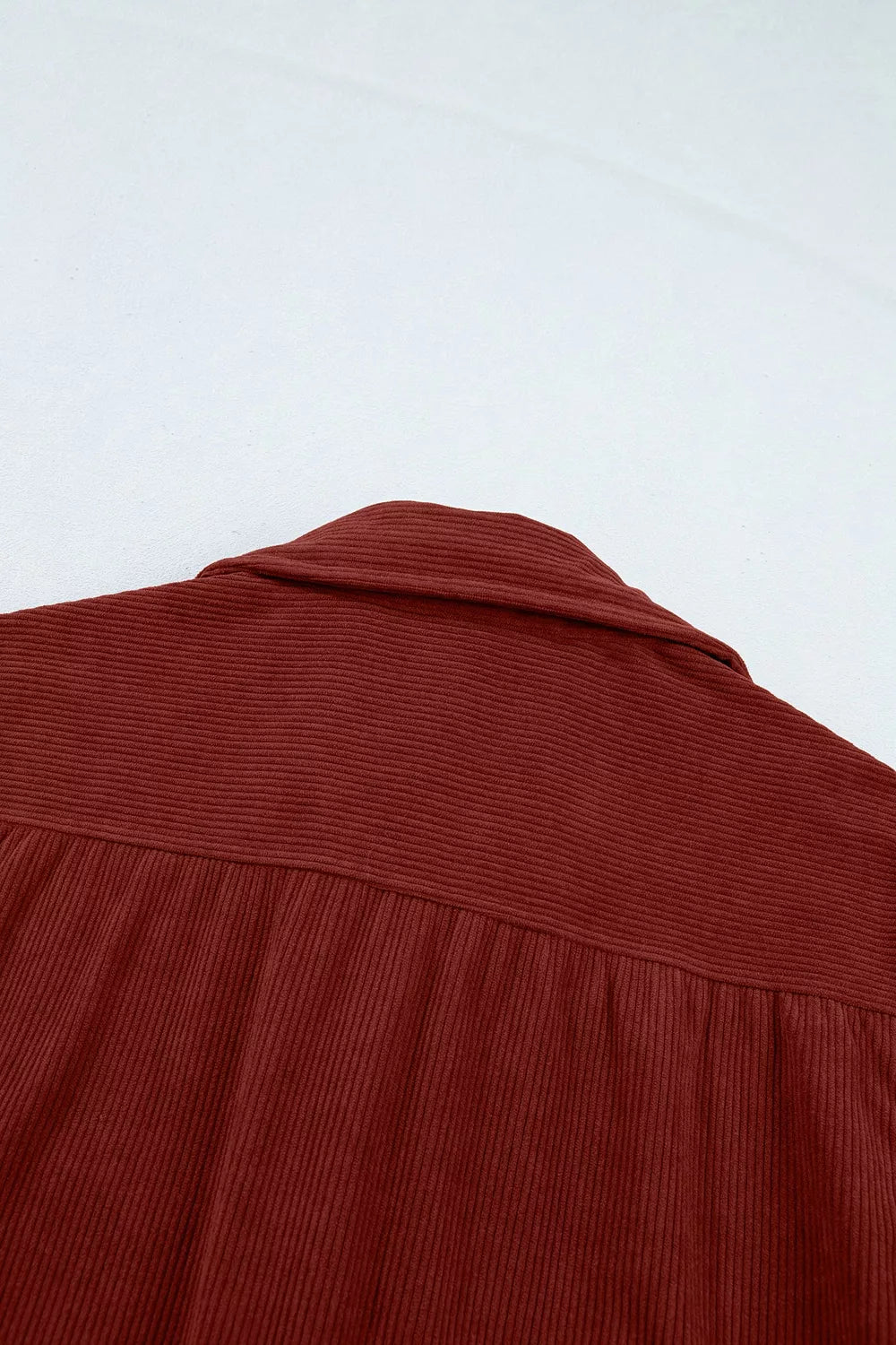Macro shot of back yoke seam and dense soft texture of 100% polyester fabric