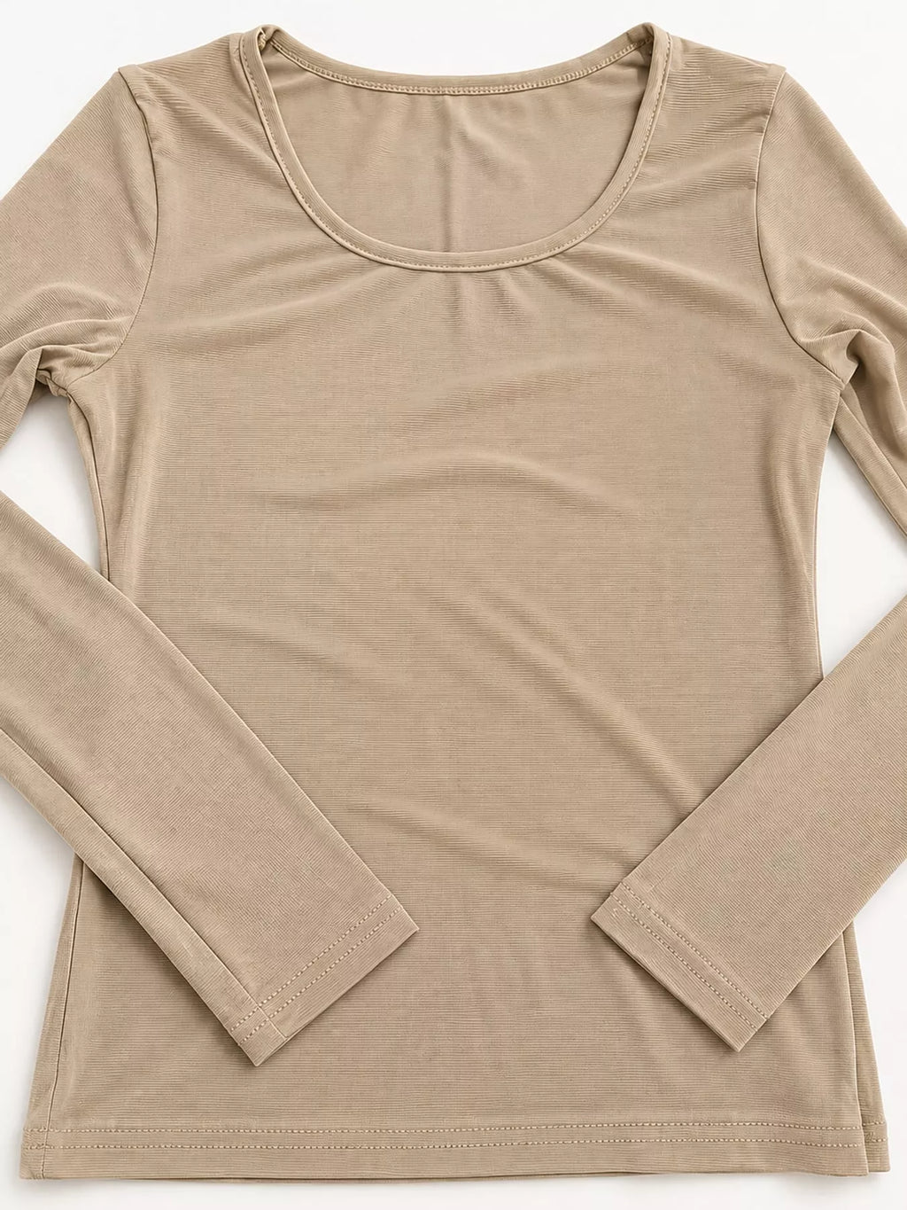 Tan bodycon long sleeve top on white background featuring wide scoop neck and clean hem stitching