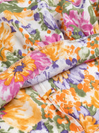 Floral Mini Dress Colorful Print Ruffled Hem Cutout Bow Tied Backless 6c187a42e7ae4afd9b523bd4ea584e3d-Max-Origin Trendsi