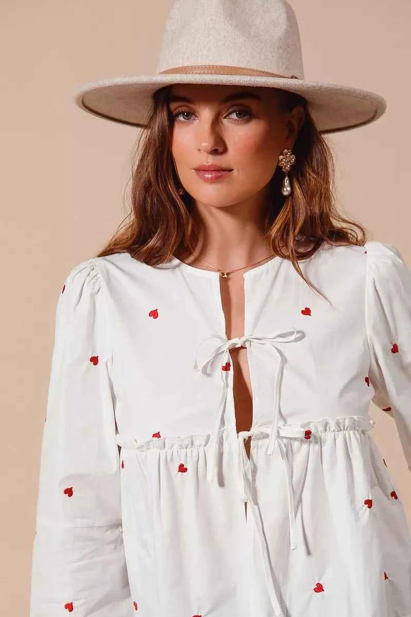 SO ME Women Blouse Front Tie Heart Embroidered Top With Puff Long Sleeve 6d1d160294ef41c888a0dd8d4ffcadd5-Max-Origin Trendsi