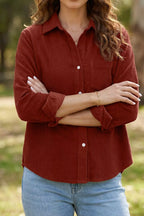 Close-up of brown hair model wearing red corduroy button-down with chest pocket detail