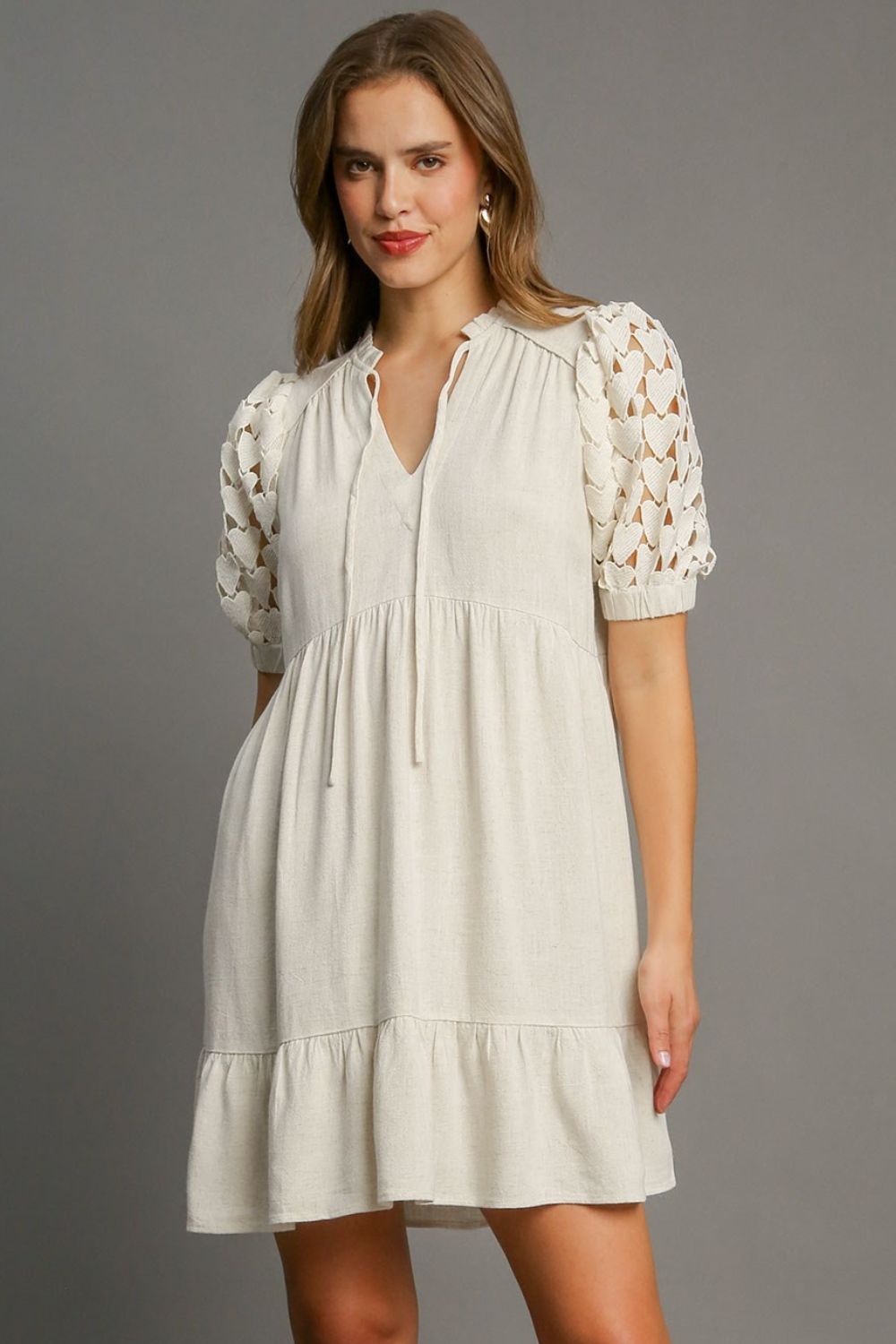 Umgee Linen Mini Dress Ruffled Hem Heart Lace Short Sleeve Tie Neck Oatmeal 756528f8-3b85-46c8-bf94-f906e41b76bb-Max Trendsi