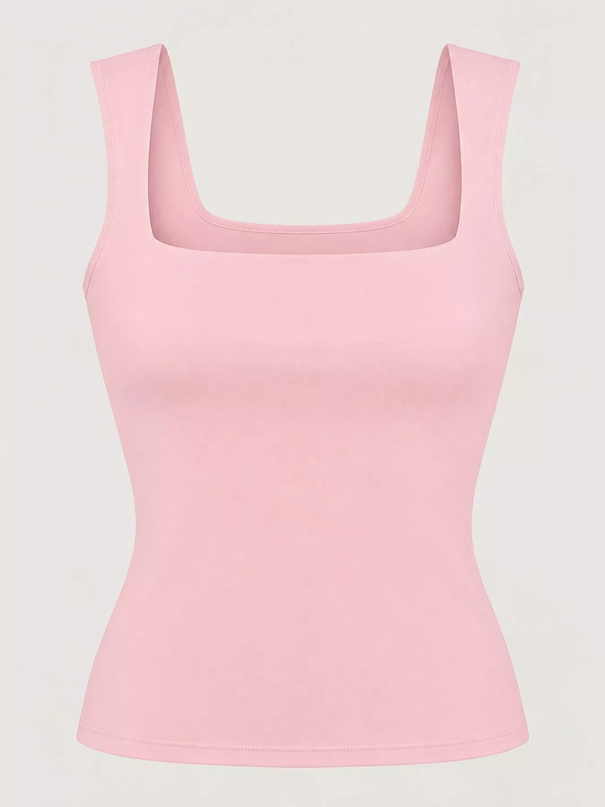 Foto de estudio de tank rosa claro en maniquí enfatizando cuello estructurado
