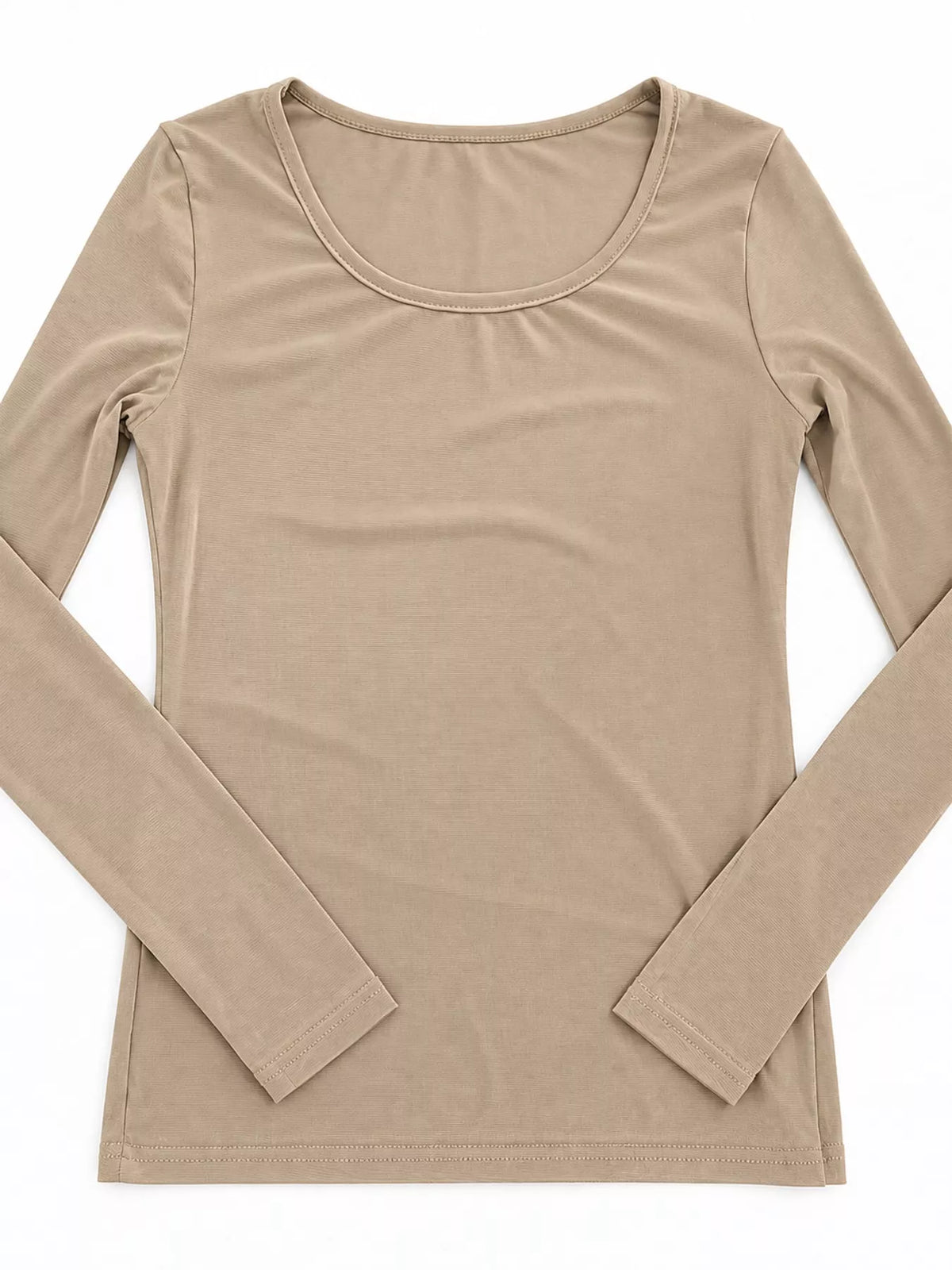 Flat-lay of beige opaque long sleeve undershirt with rounded scoop neck and ribbed cuffs