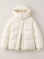 Front flat-lay of cream puffer jacket showing horizontal baffle stitching, snap button collar, and ribbed cuffs