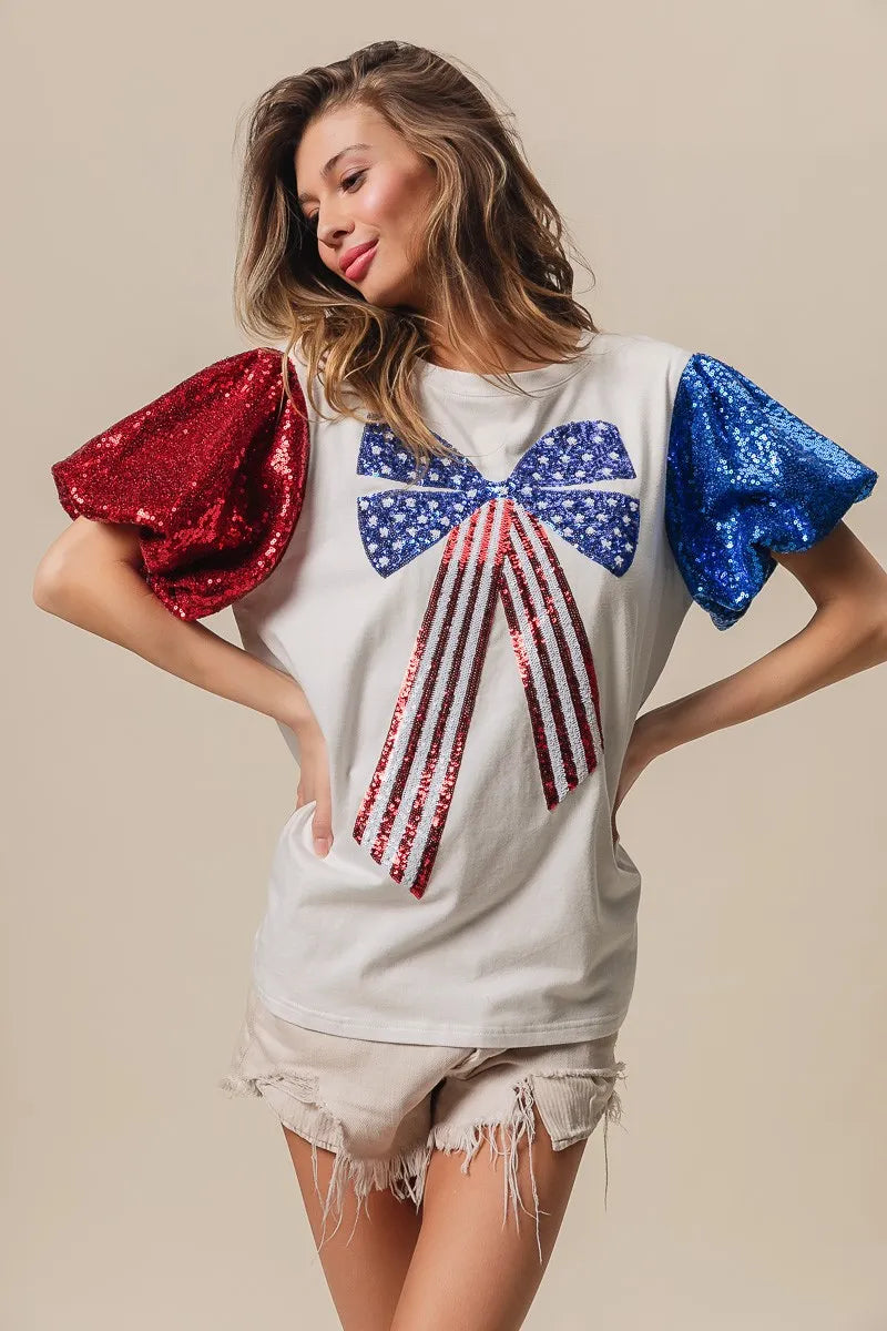 BiBi Cotton T-shirt Sequin American Flag Bow Top Short Puff Sleeve 876b99e97db049cbb9f3520476561a58-Max-Origin Trendsi