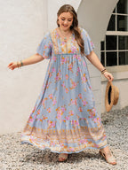 Plus Size Printed Maxi Dress with Tie Neck and Flutter Sleeves
