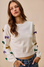 SO ME Sweater Knit Top Mardi Gras Glitter Bow Ribbon Ivory 99e1548e444b4a14b380478ec3723016-Max-Origin Trendsi