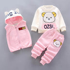 Mixed-color toddler set with pink vest, cream sweatshirt, and pink pants featuring bear appliqué details
