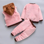 Back detail of pink fleece set highlighting quilted vest stitching and smooth sweatshirt texture on pants