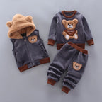 Grey toddler fleece ensemble with fuzzy bear-ear hood, large teddy bear graphic, and coordinating patches