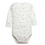 White long sleeve bodysuit with scattered black arrow prints, round neck, raglan sleeves, and crotch snaps