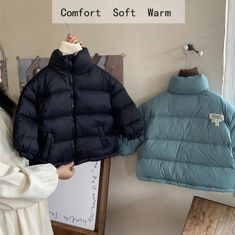 Black and teal stand collar puffer jackets hanging with text overlay reading Comfort Soft Warm and brand patch.