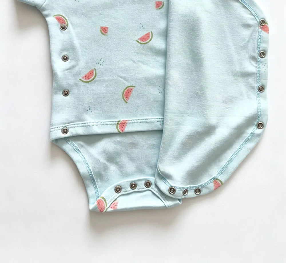 Light blue short-sleeve bodysuit with watermelon slice print, side snap closure, and ribbed leg openings