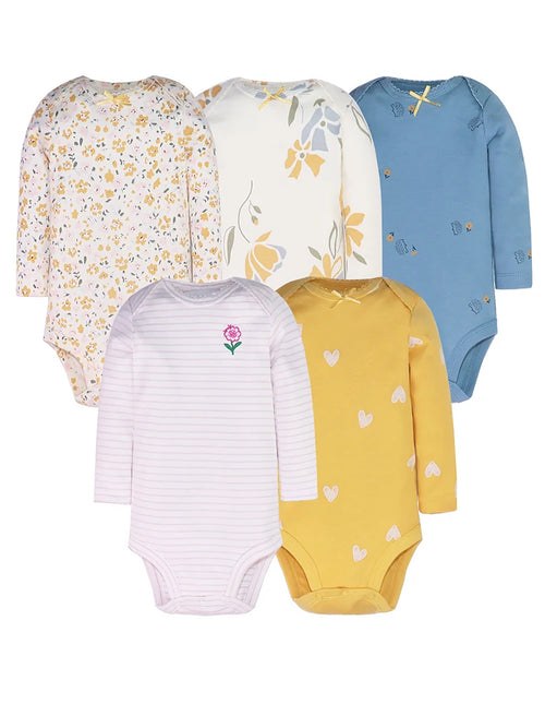 Five long sleeve baby bodysuits in floral, blue hedgehog, pink stripe, and mustard heart prints arranged on white