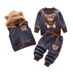 Grey toddler fleece set with bear-ear hood, embroidered patch, and sweatshirt showing teddy bear graphic