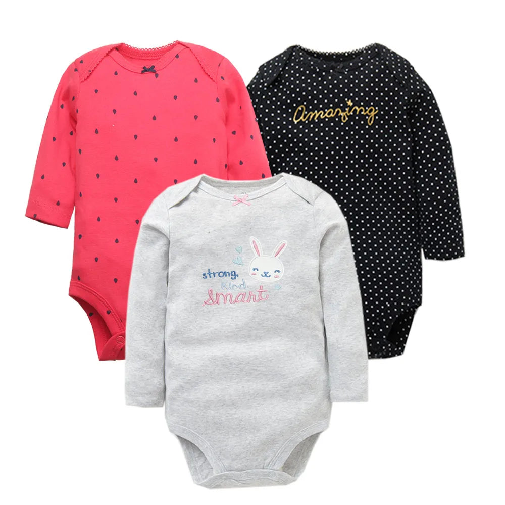 Three girl bodysuits in coral, black, and grey with heart, polka dot, and bunny graphics for daily wear