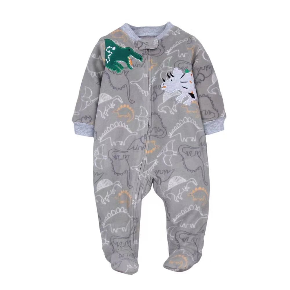Grey jumpsuit with dinosaur outlines and two 3D fabric appliqués: green T-Rex and grey Triceratops on chest