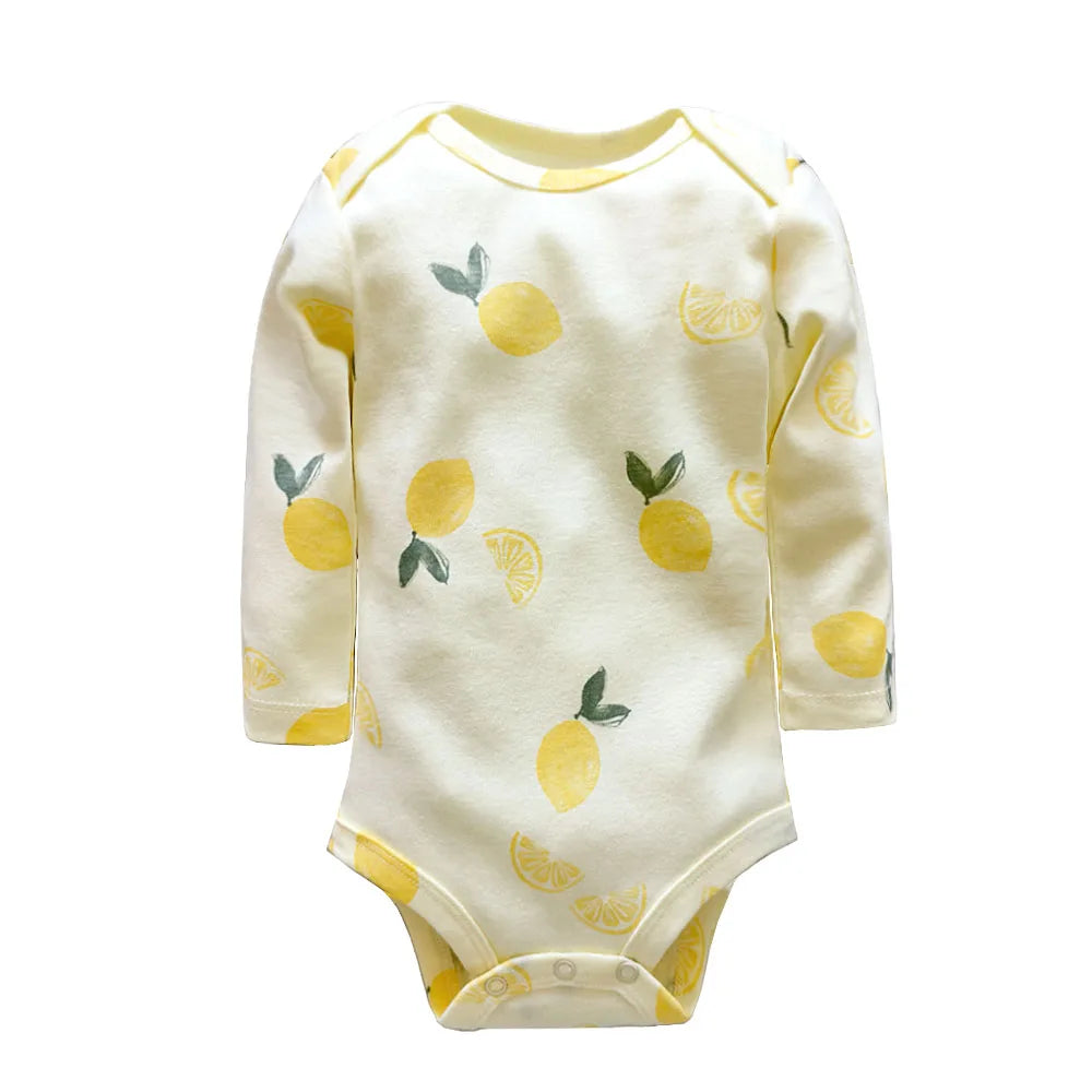 Cream lemon print onesie with yellow lemons and green leaves displayed flat with crotch snaps
