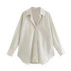 Camicia maniche lunghe oversize avorio opaco con finitura lucente e stile taglio allungato moderno