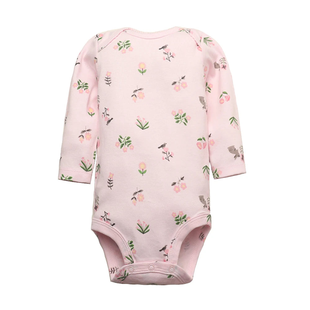 Light pink long sleeve bodysuit with whimsical print of green plants, pink flowers, and grey birds